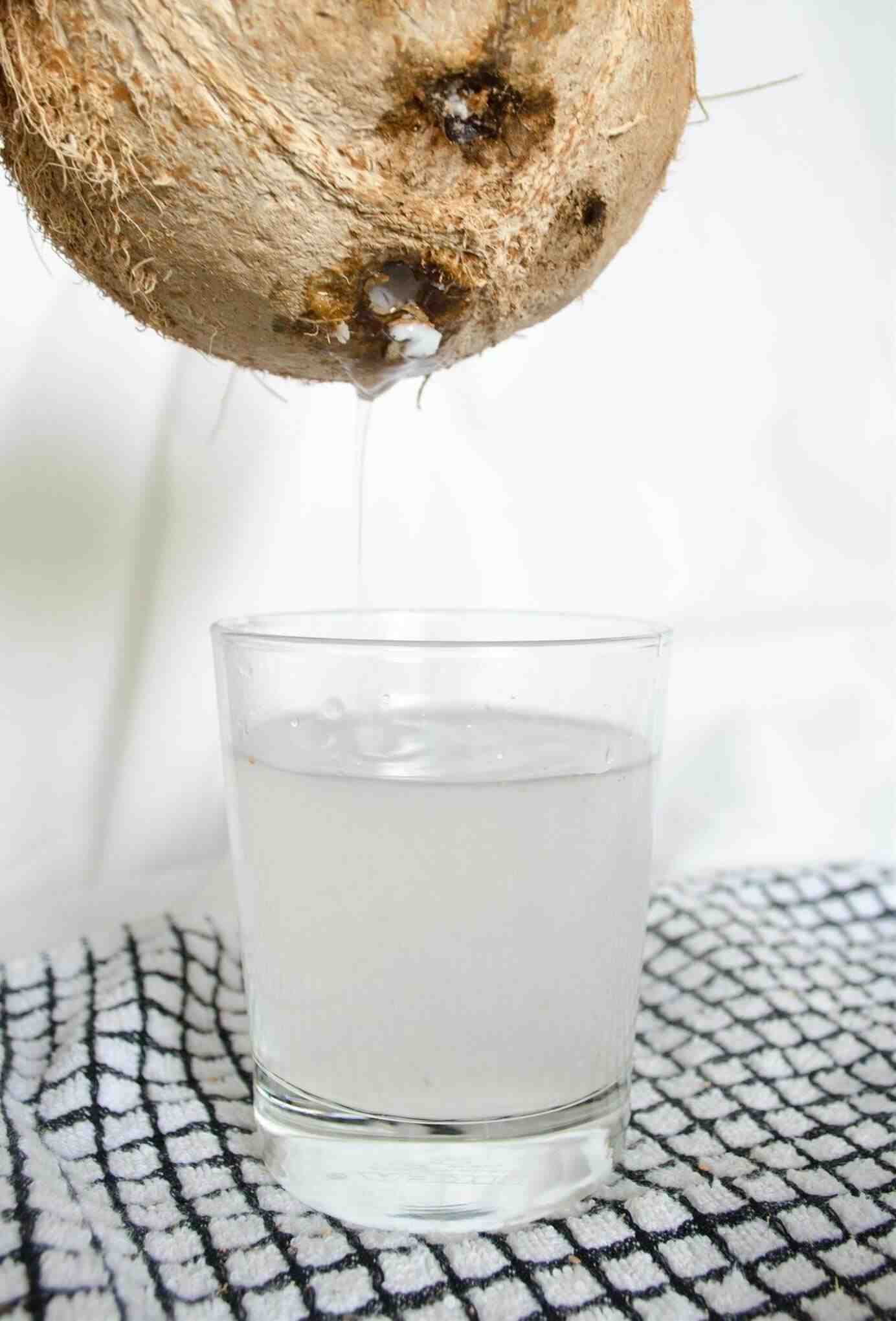 How do you get the water out of a coconut?