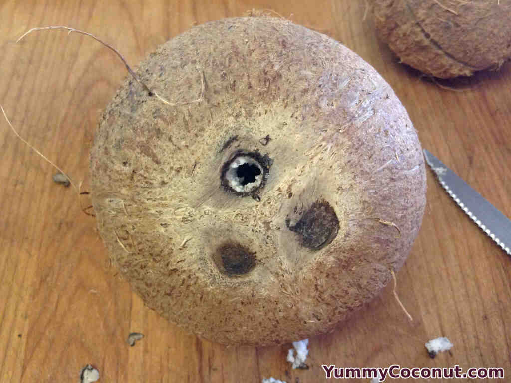 How do you open a coconut eye?