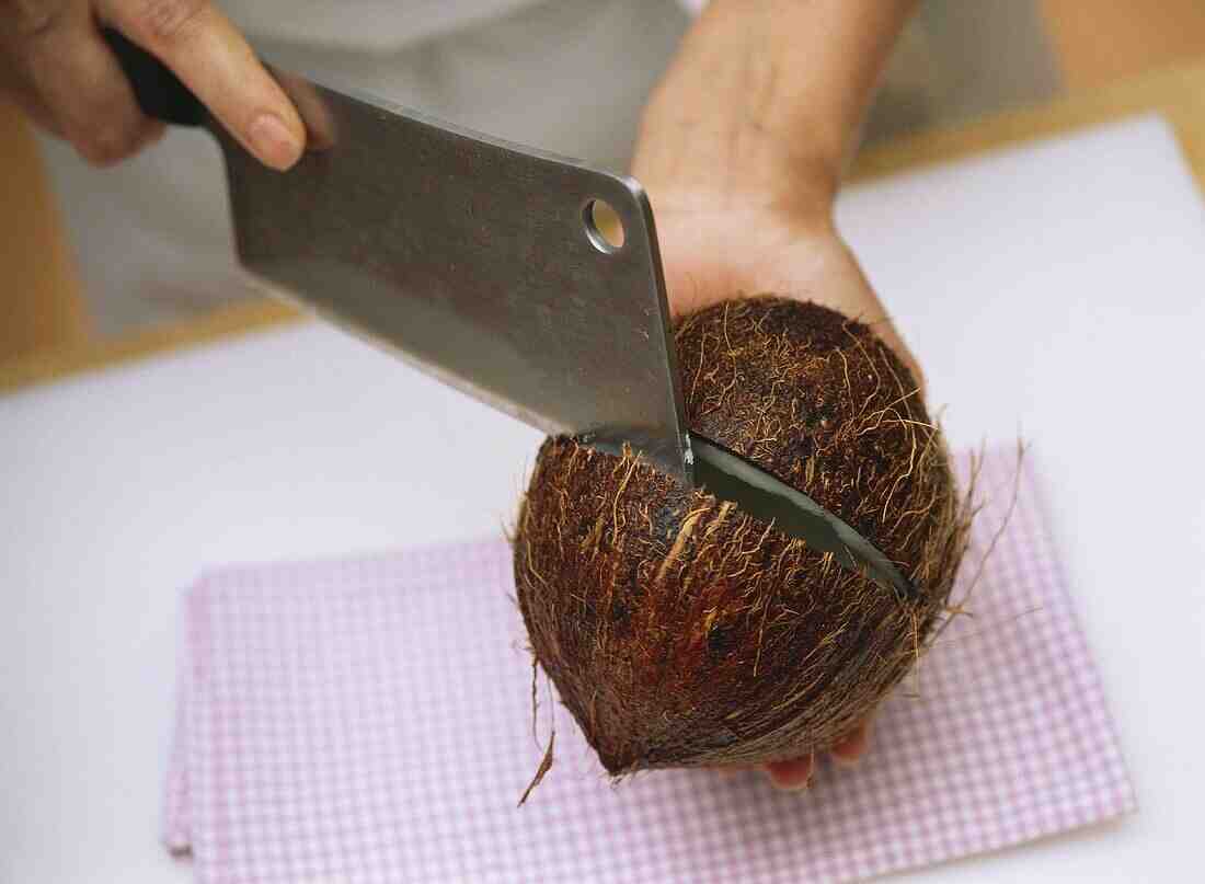How do you open a coconut with a cleaver?