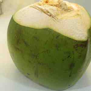 How do you open a green coconut shell?
