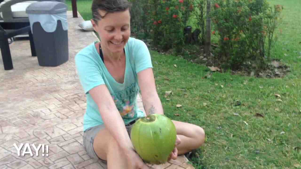 How do you open a green coconut without tools?