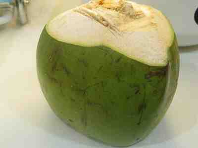 How do you open a thick coconut?